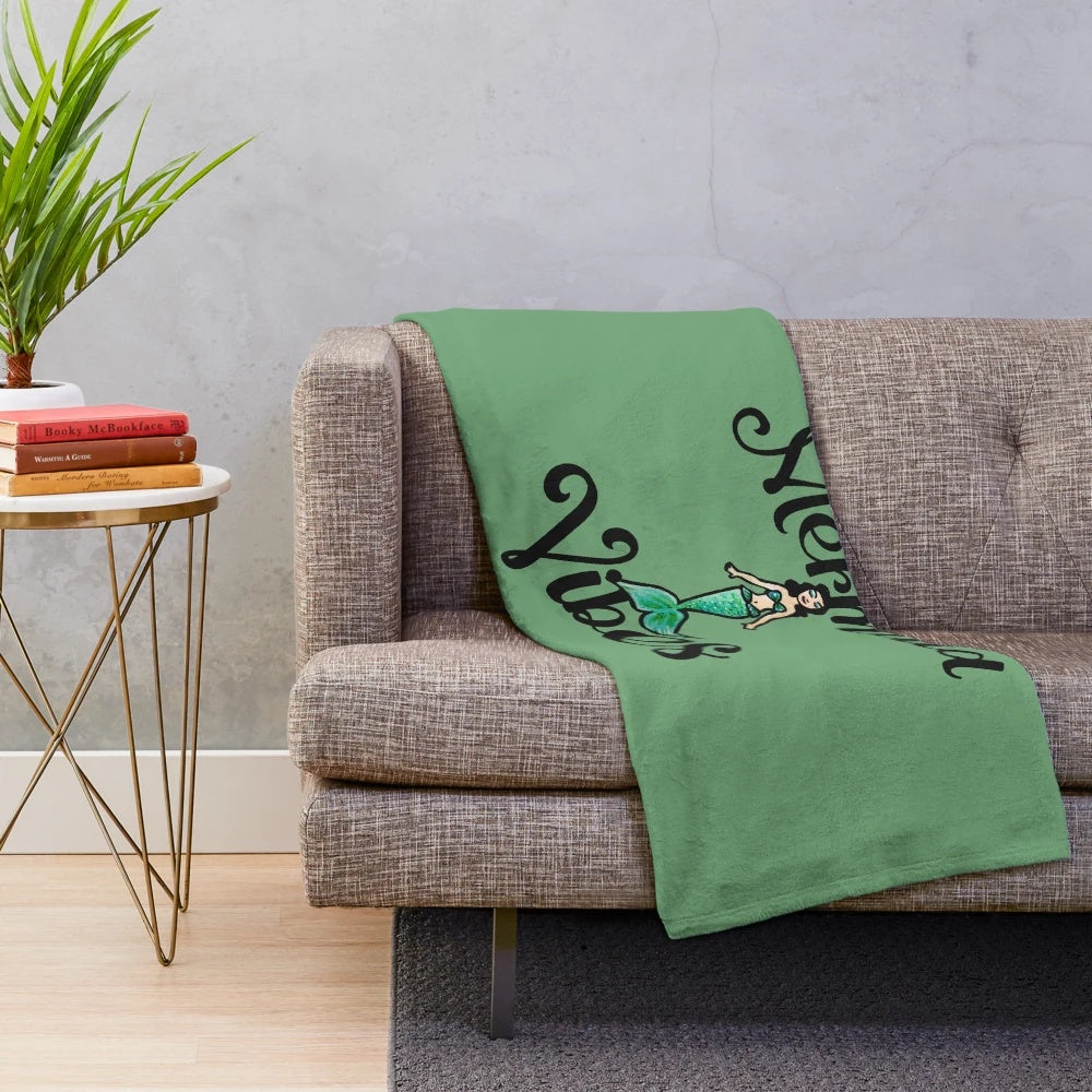 Mermaid-themed plush blanket with a soft and cozy design