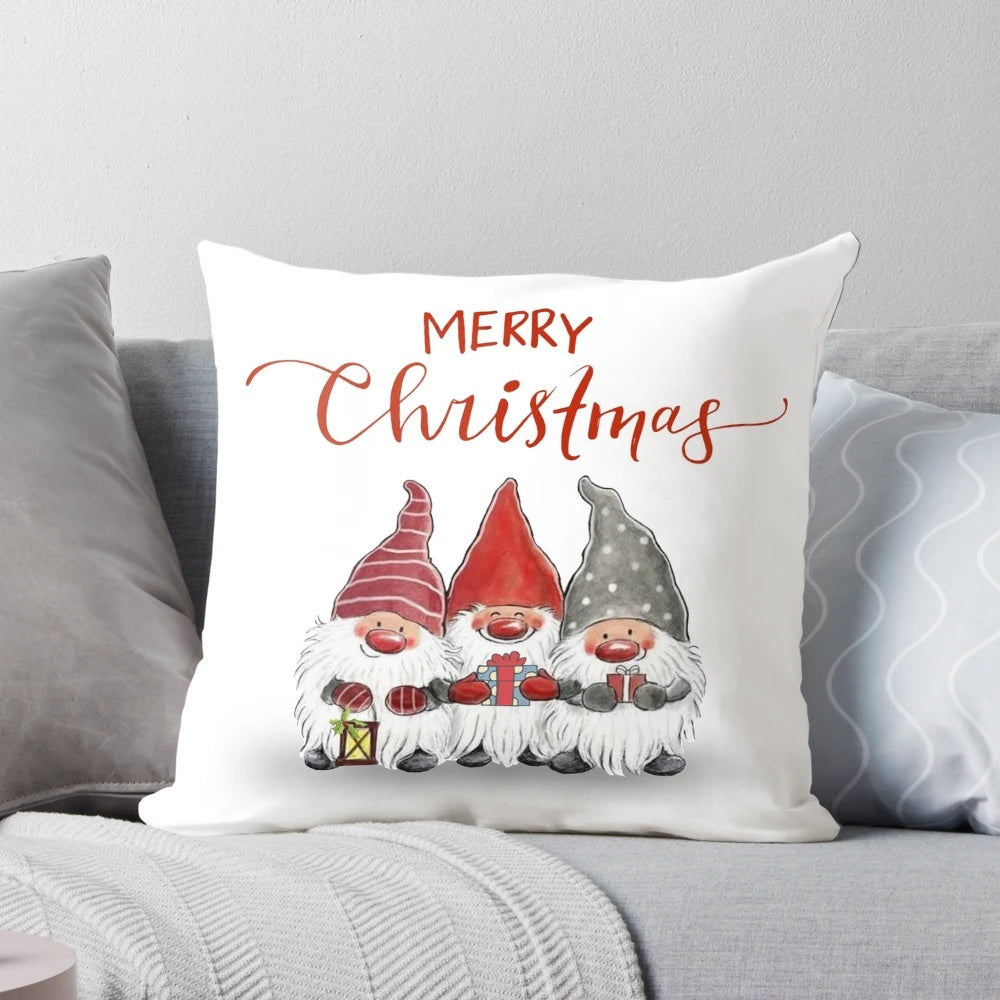 A plush, festive pillow featuring cute cartoon Christmas gnomes in a whimsical design.