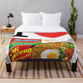 Mi Goreng inspired plush blanket with Indomie noodle design
