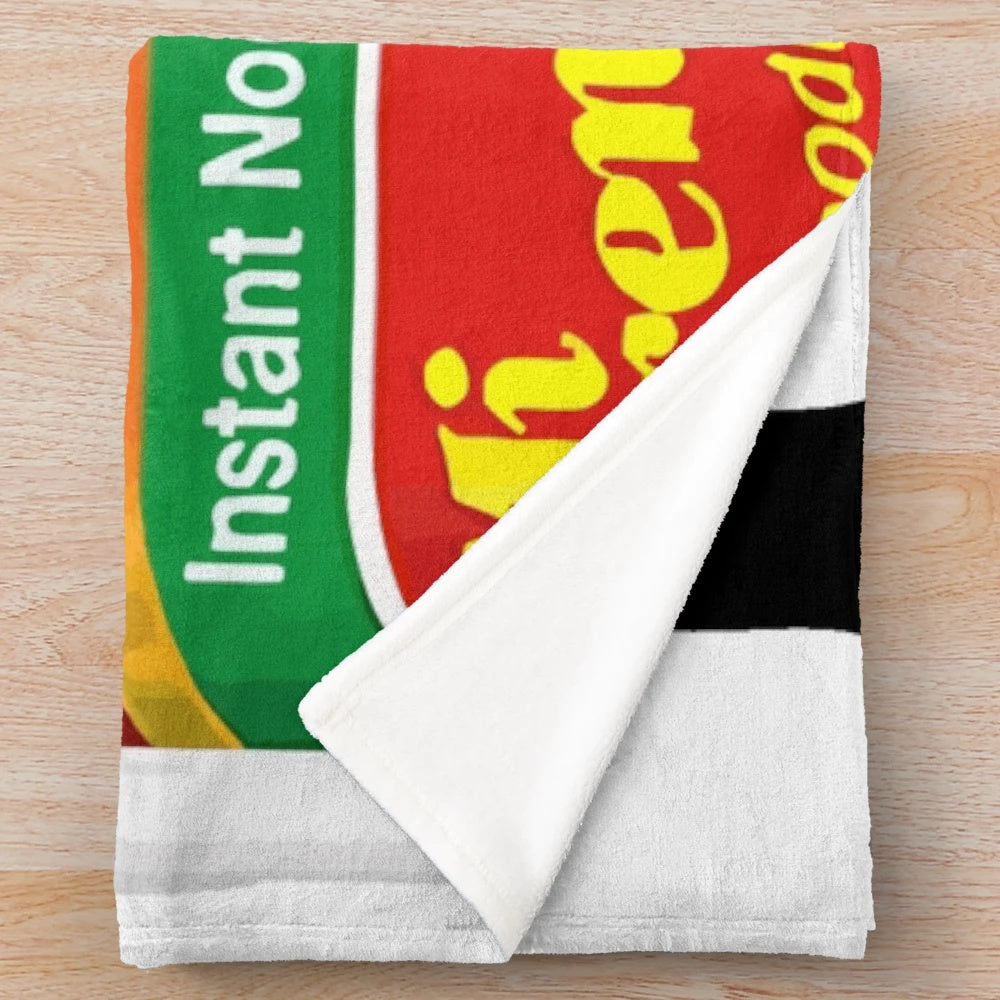 Mi Goreng inspired plush blanket with Indomie noodle design