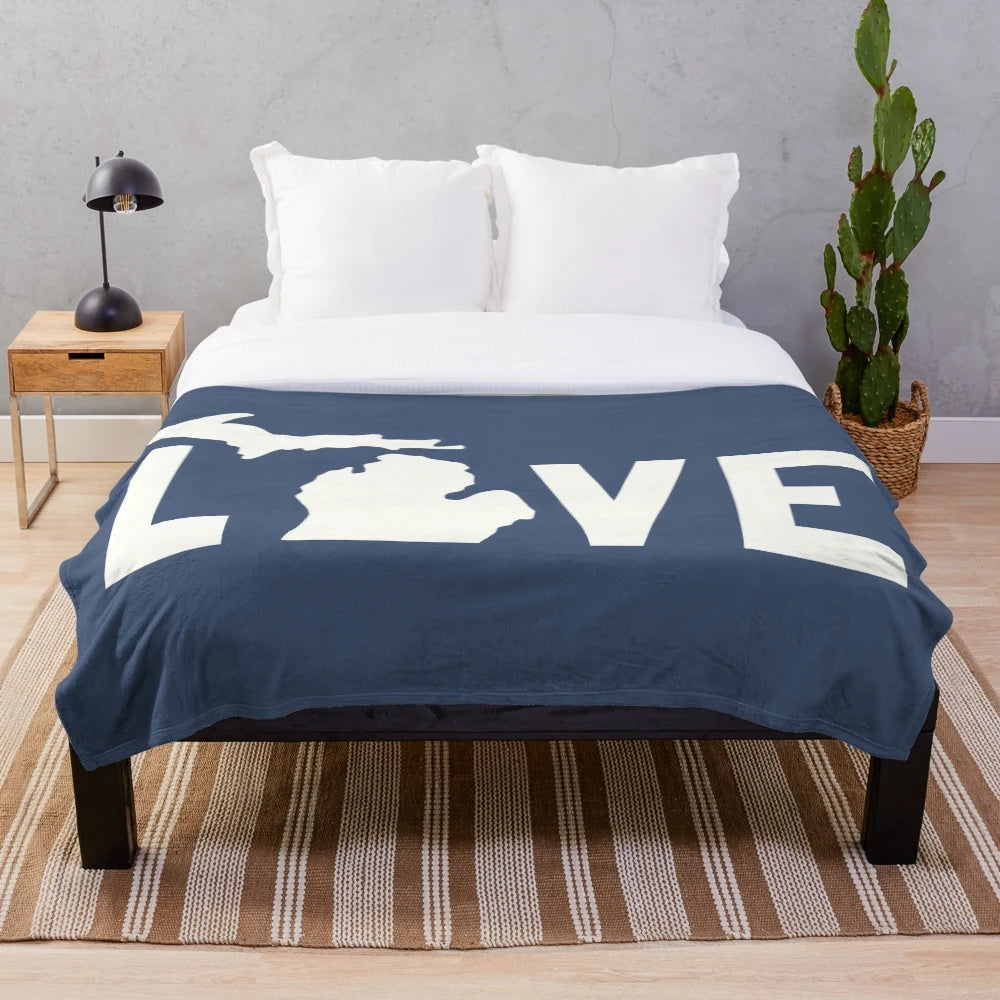 Plush white blanket with Michigan-inspired design