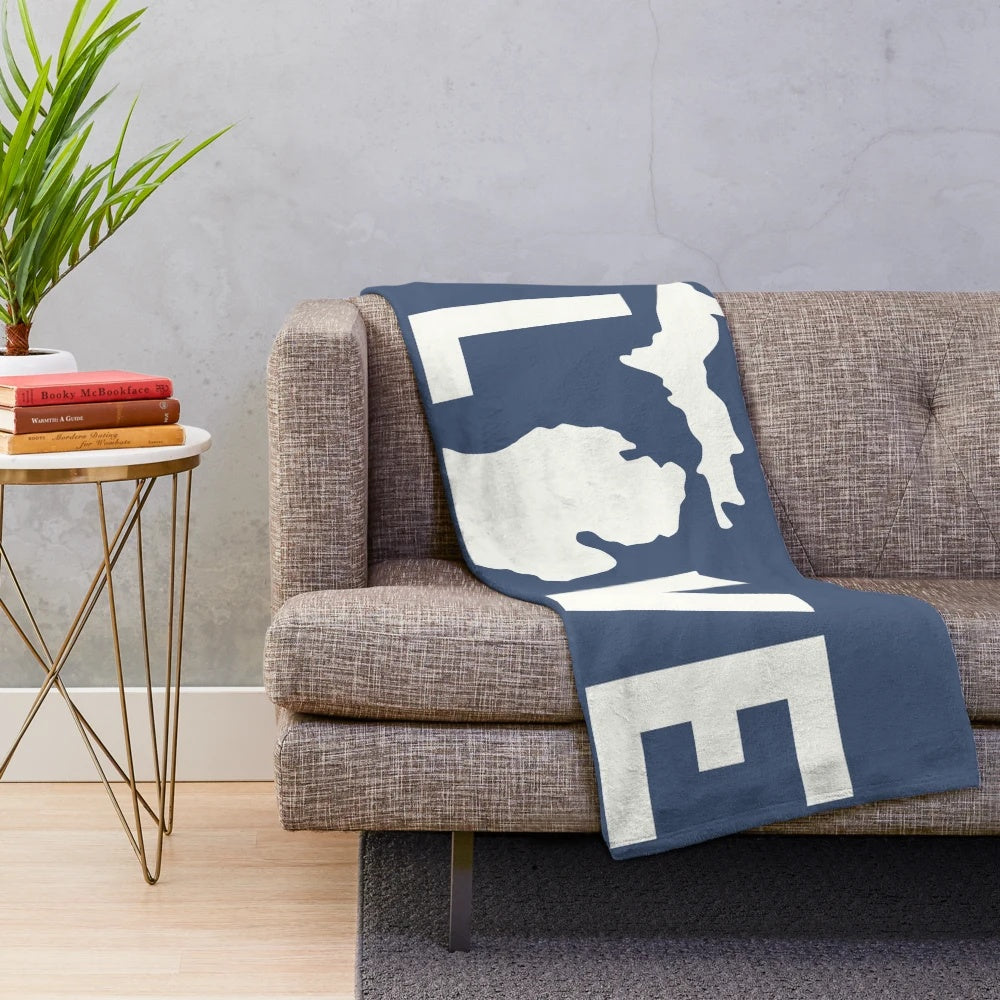 Plush white blanket with Michigan-inspired design