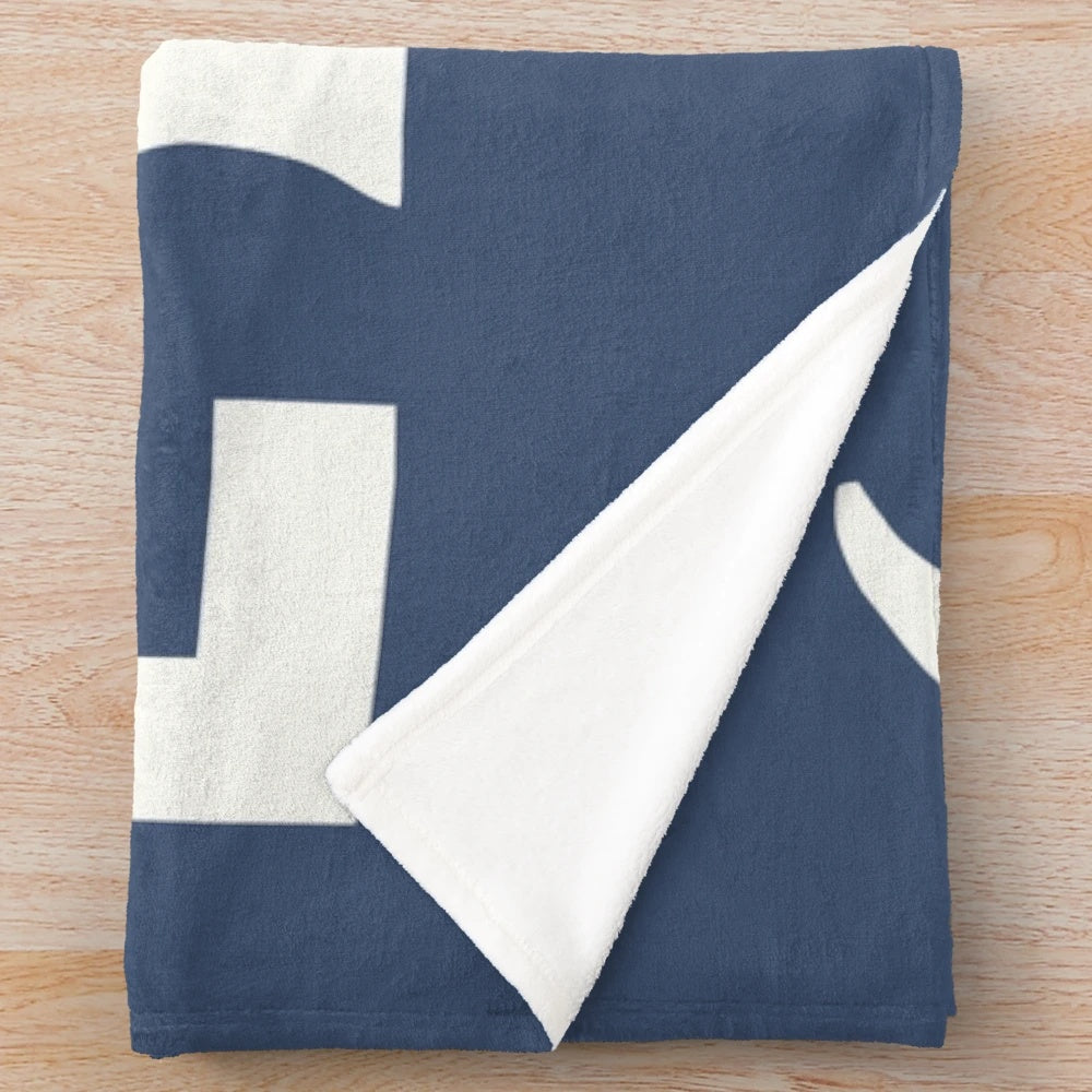 Plush white blanket with Michigan-inspired design
