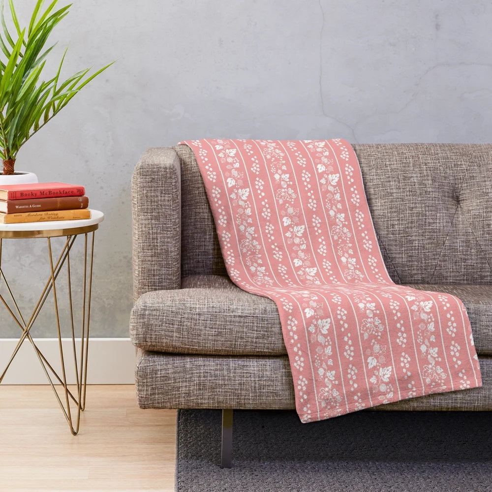 Midcentury-inspired plush blanket with vintage floral and leaf print design