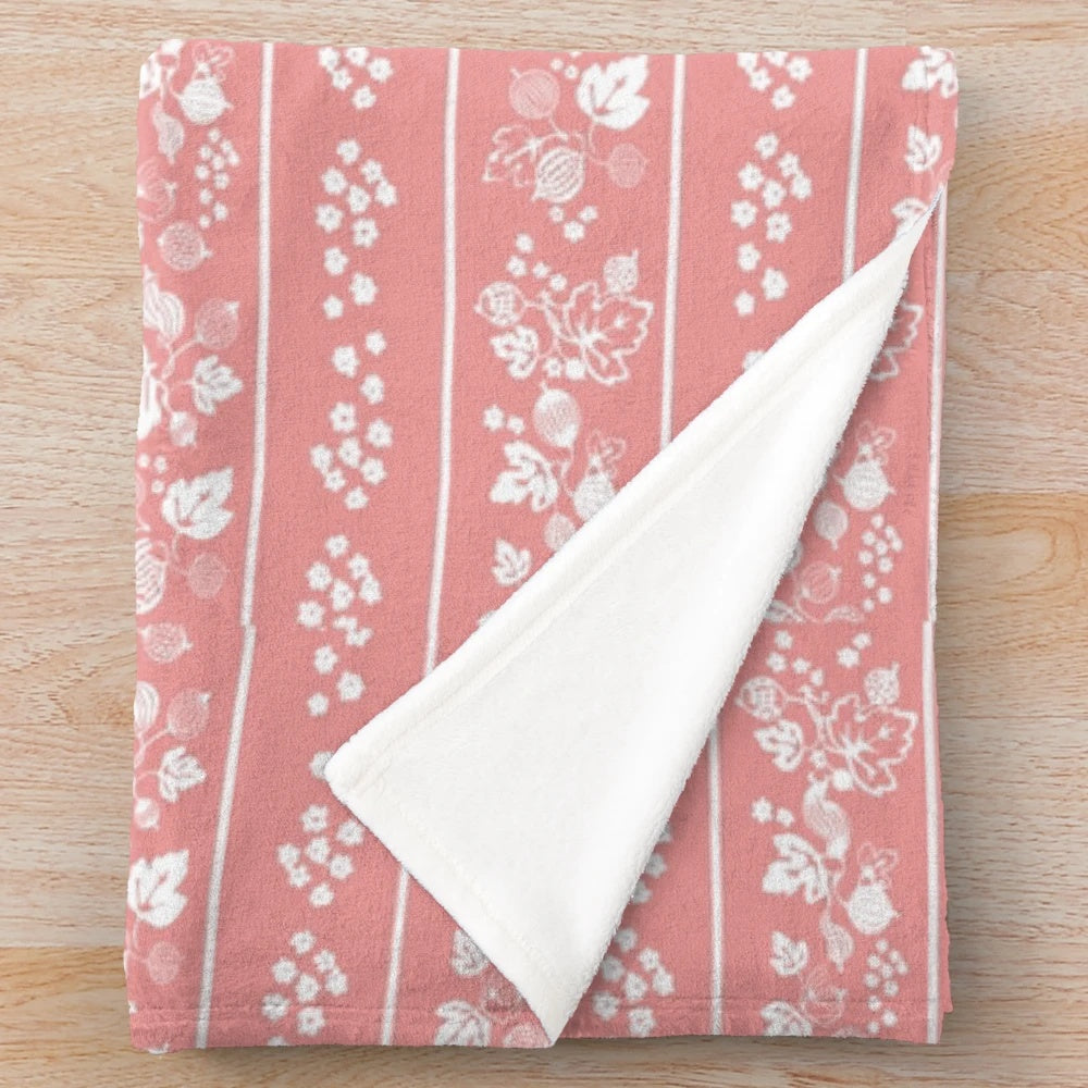 Midcentury-inspired plush blanket with vintage floral and leaf print design