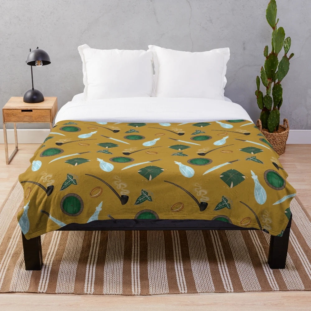 A soft and cozy plush blanket featuring Lord of the Rings inspired designs and characters