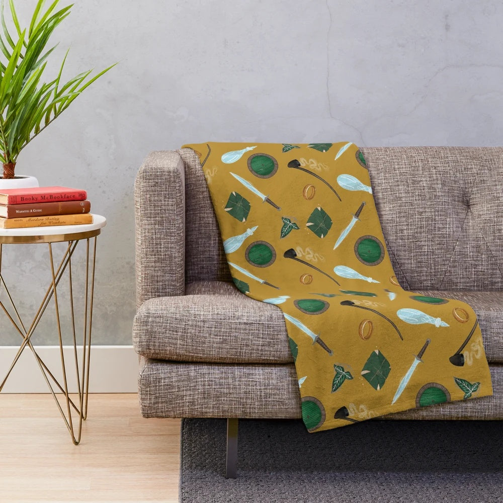A soft and cozy plush blanket featuring Lord of the Rings inspired designs and characters