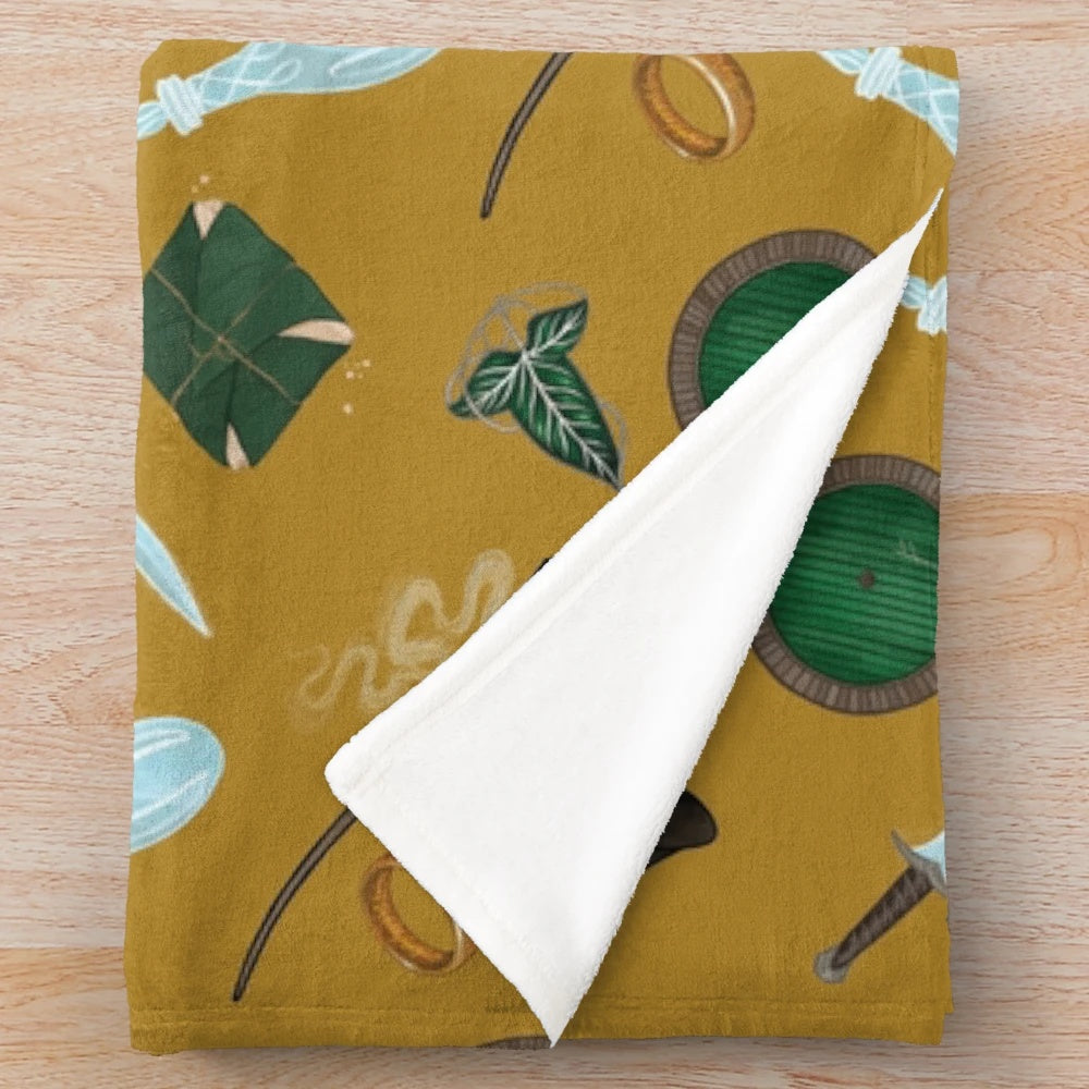 A soft and cozy plush blanket featuring Lord of the Rings inspired designs and characters