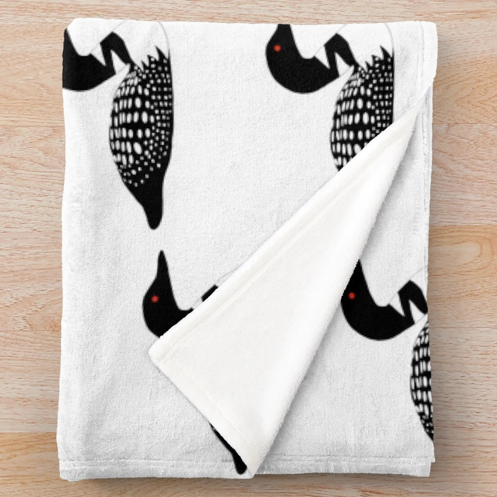 Minnesota lake loon plush blanket featuring a black and white bird with a red eye sitting on a boat in a summer lake landscape