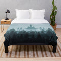 Soft and cozy plush blanket featuring a castle design