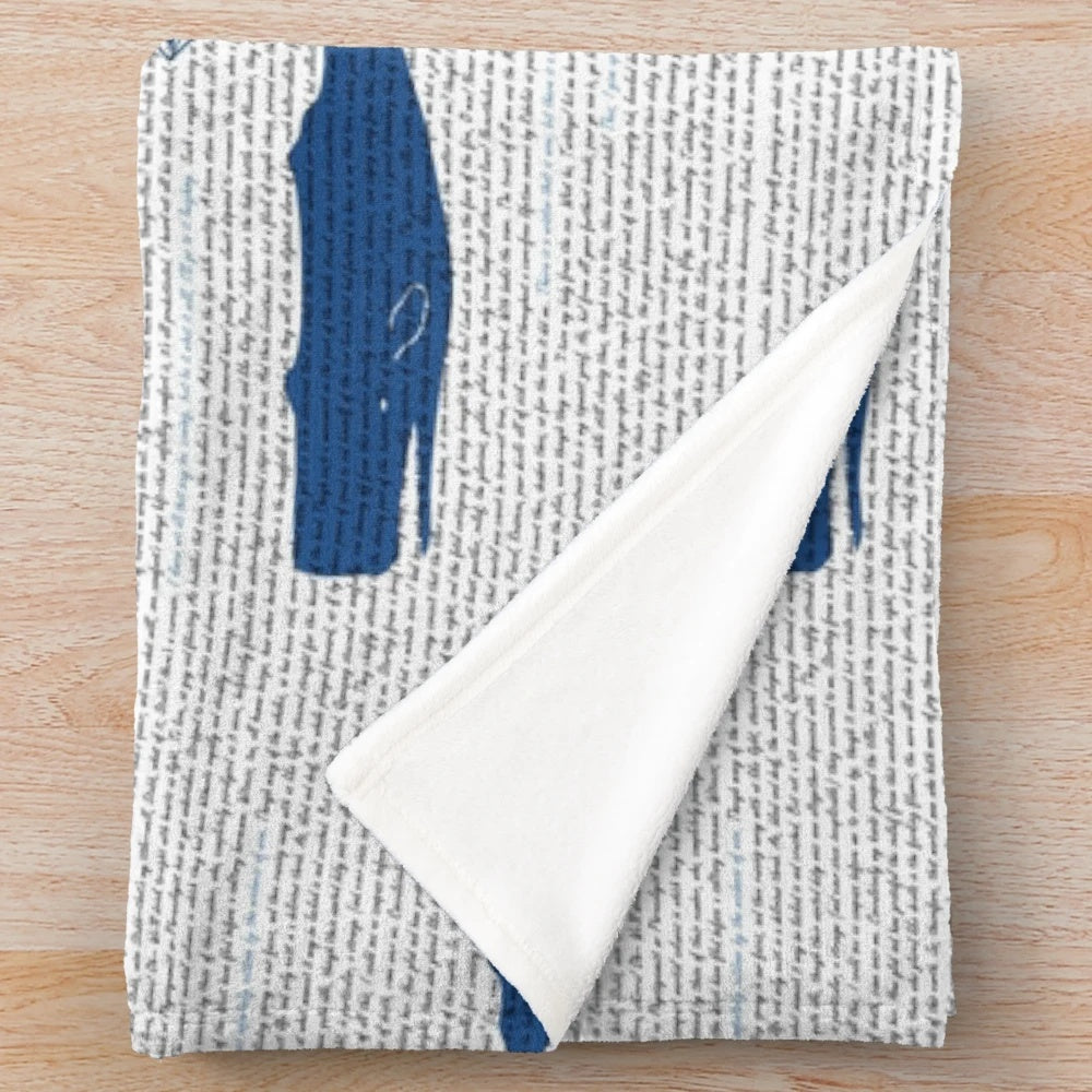Moby Dick themed plush blanket with whales, ships, and ocean motifs