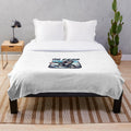 Cuddly monkey plush blanket with skateboard design