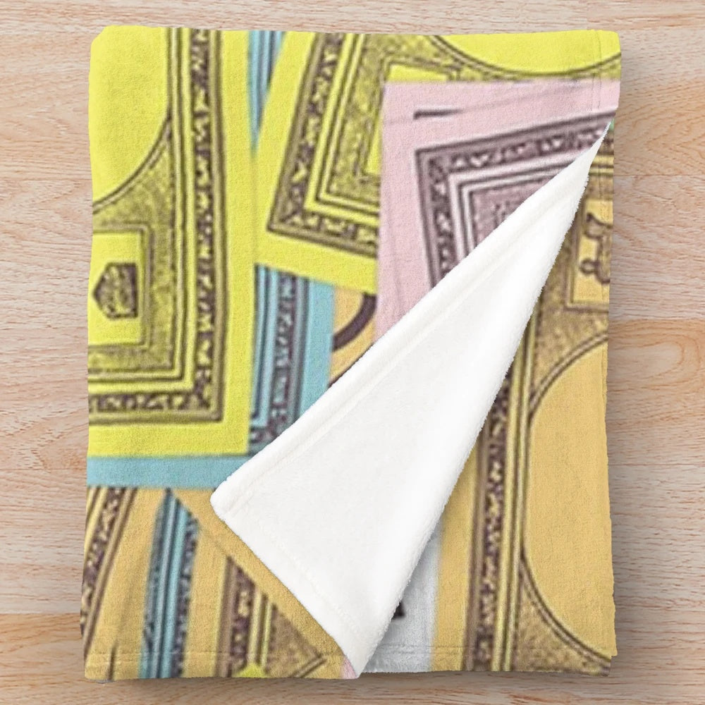 Monopoly-themed plush blanket with iconic character and money design