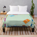 Monopoly-themed plush blanket with classic board game design