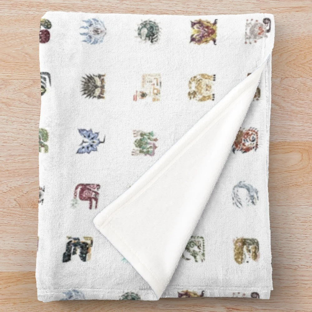 Monster Hunter-themed plush blanket featuring iconic monster graphics