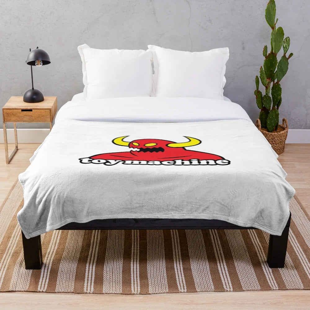 Monster machine plush blanket with wheels and skateboard design