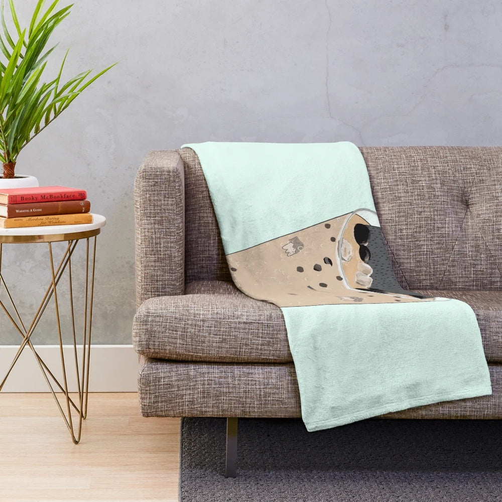 Colorful and whimsical monster-themed plush blanket for bubble tea enthusiasts