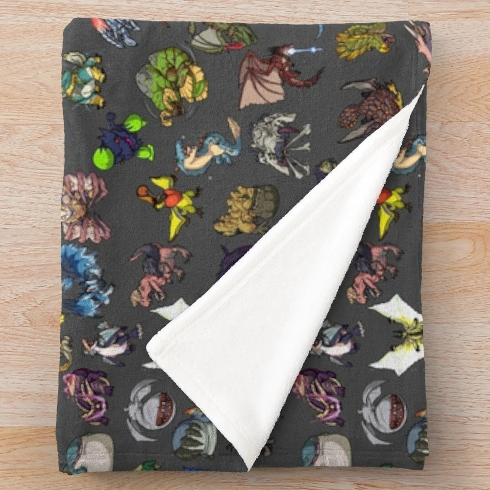 Monster Hunter-inspired plush blanket featuring popular characters and monsters