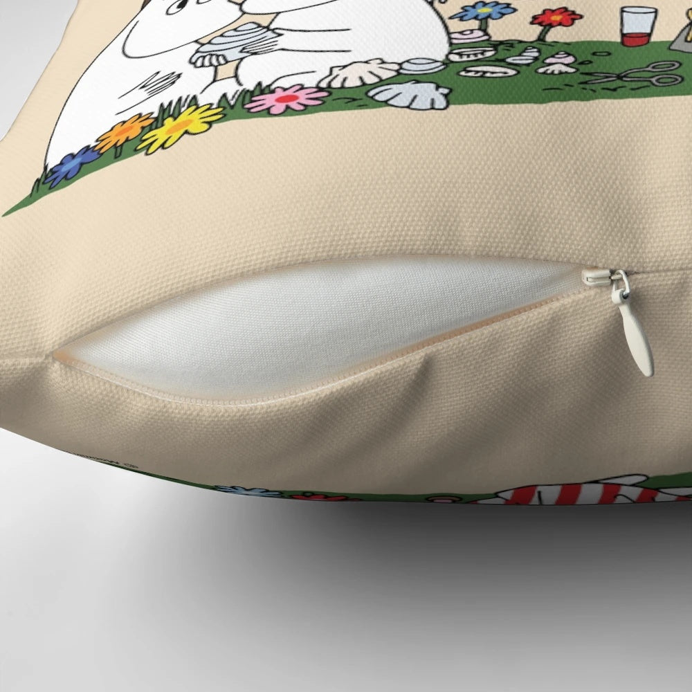 Moomin family characters relaxing on a soft, plush pillow