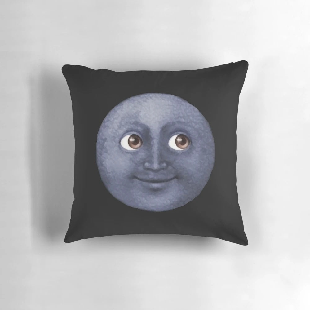 Soft and plush moon emoji pillow in a black and white cosmic design
