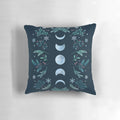 Teal and mint green pillow with a moonlit winter garden scene, featuring snowflakes and a full moon