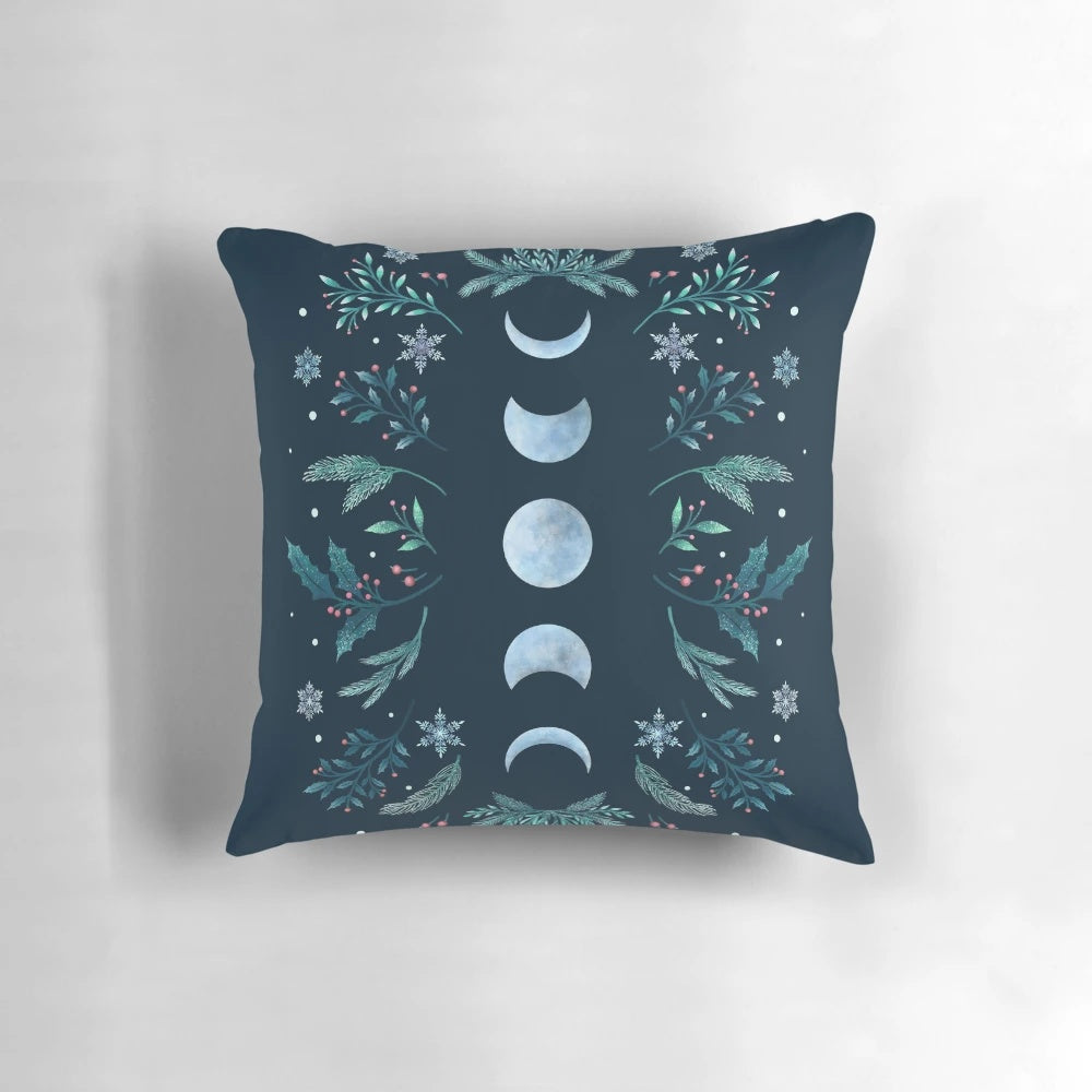 Teal and mint green pillow with a moonlit winter garden scene, featuring snowflakes and a full moon
