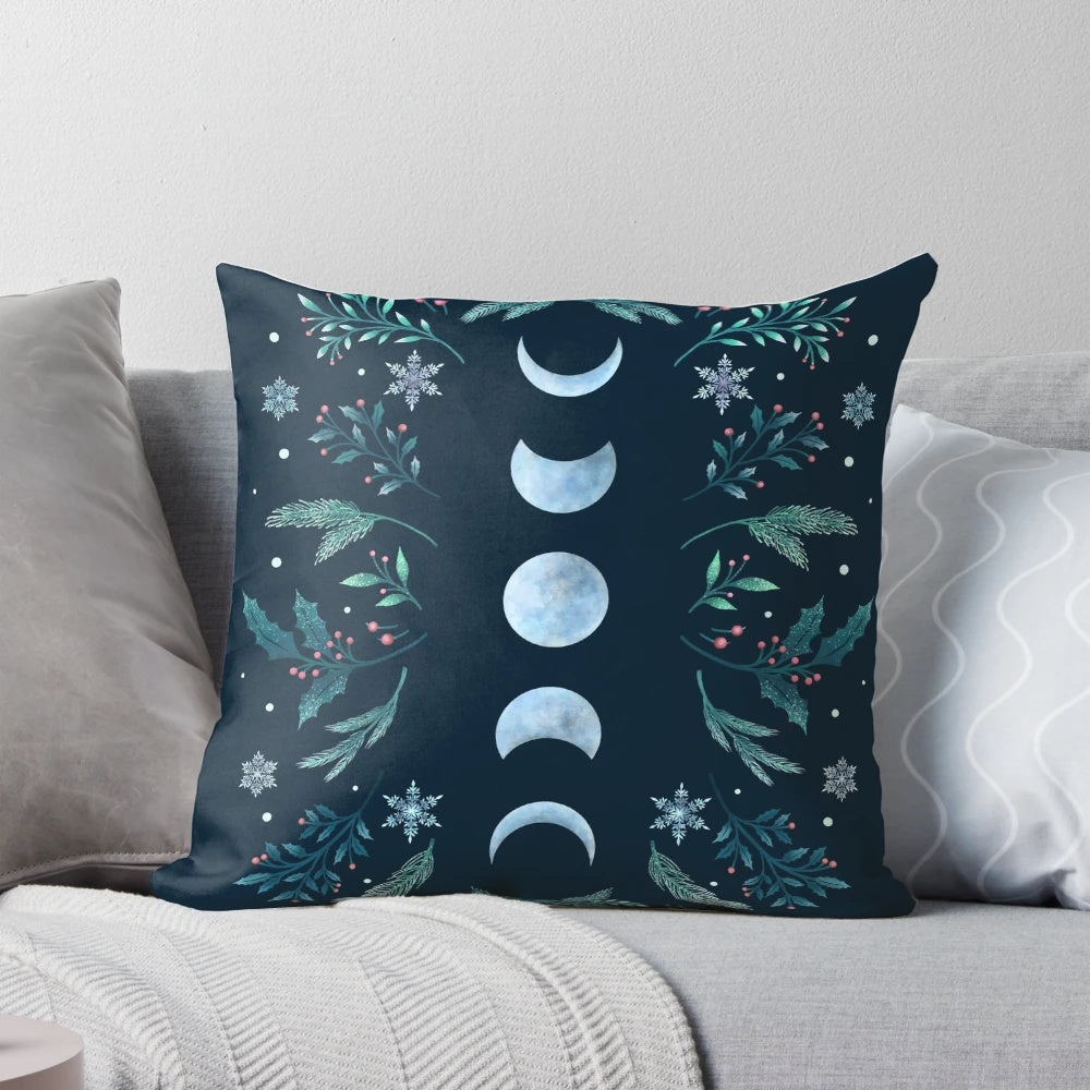 Teal and mint green pillow with a moonlit winter garden scene, featuring snowflakes and a full moon