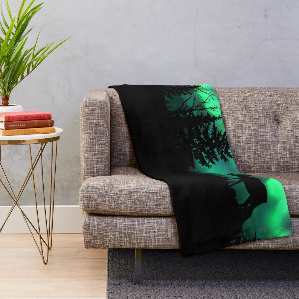 Moose plush blanket with northern forest and aurora borealis design