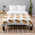 Moose plush blanket with colorful, abstract animal art design