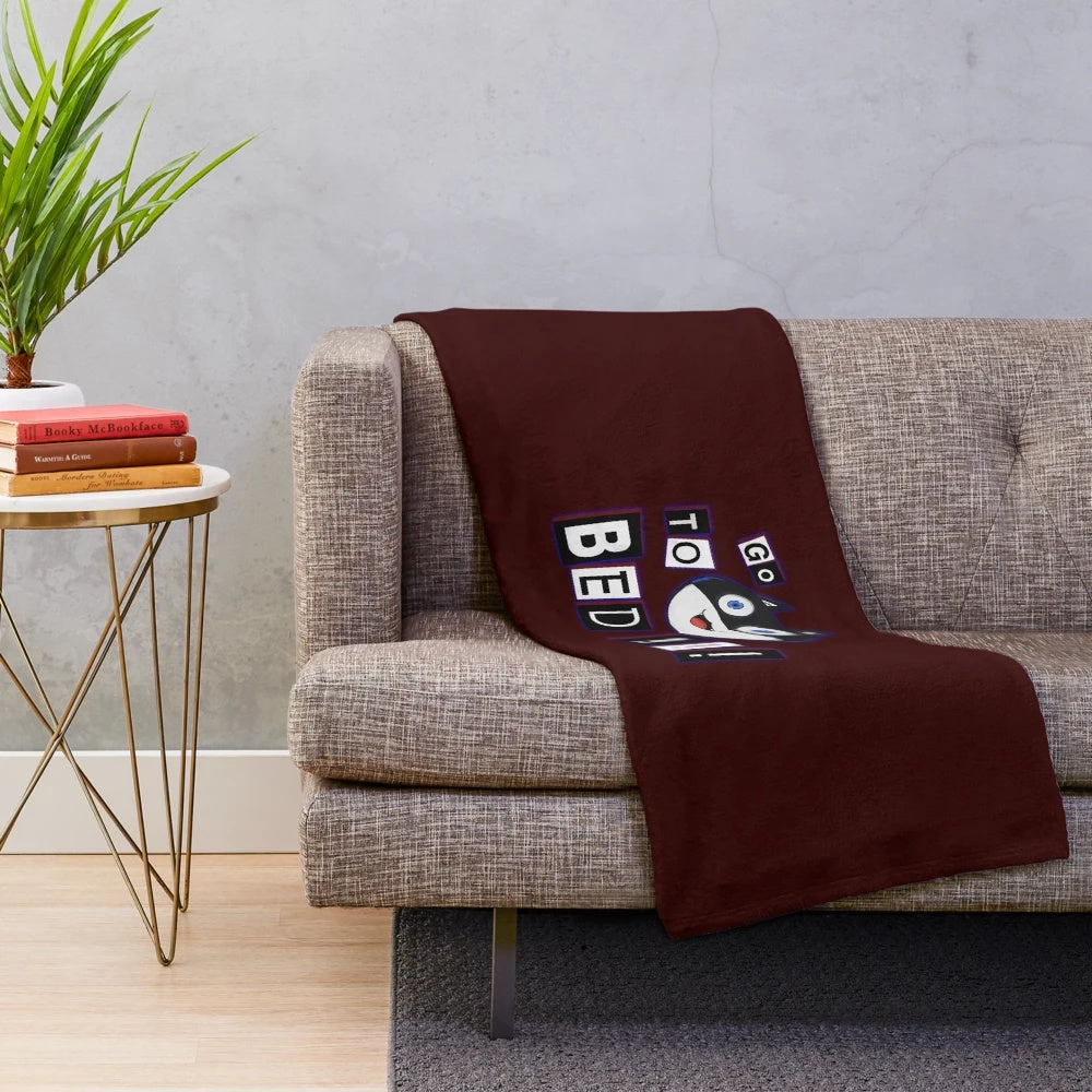 A soft and cuddly plush blanket featuring the cat-like character Morgana from the video game Persona 5.