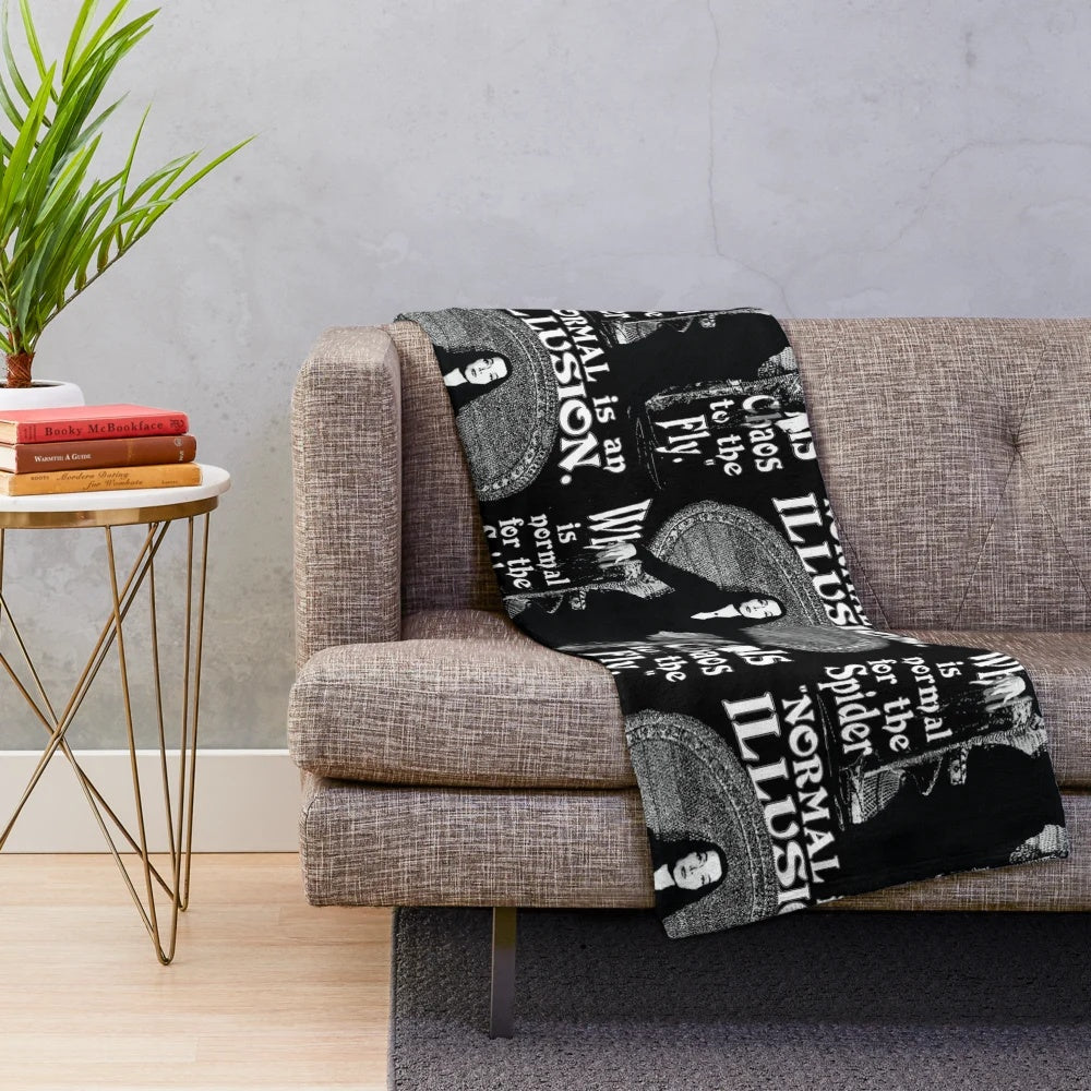 Morticia Addams-inspired plush blanket with "Normal Is An Illusion" quote
