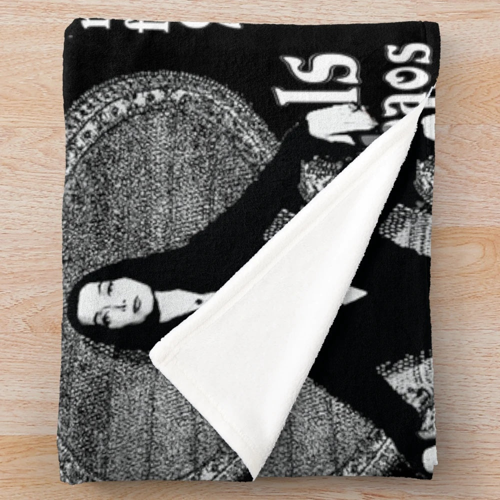 Morticia Addams-inspired plush blanket with "Normal Is An Illusion" quote