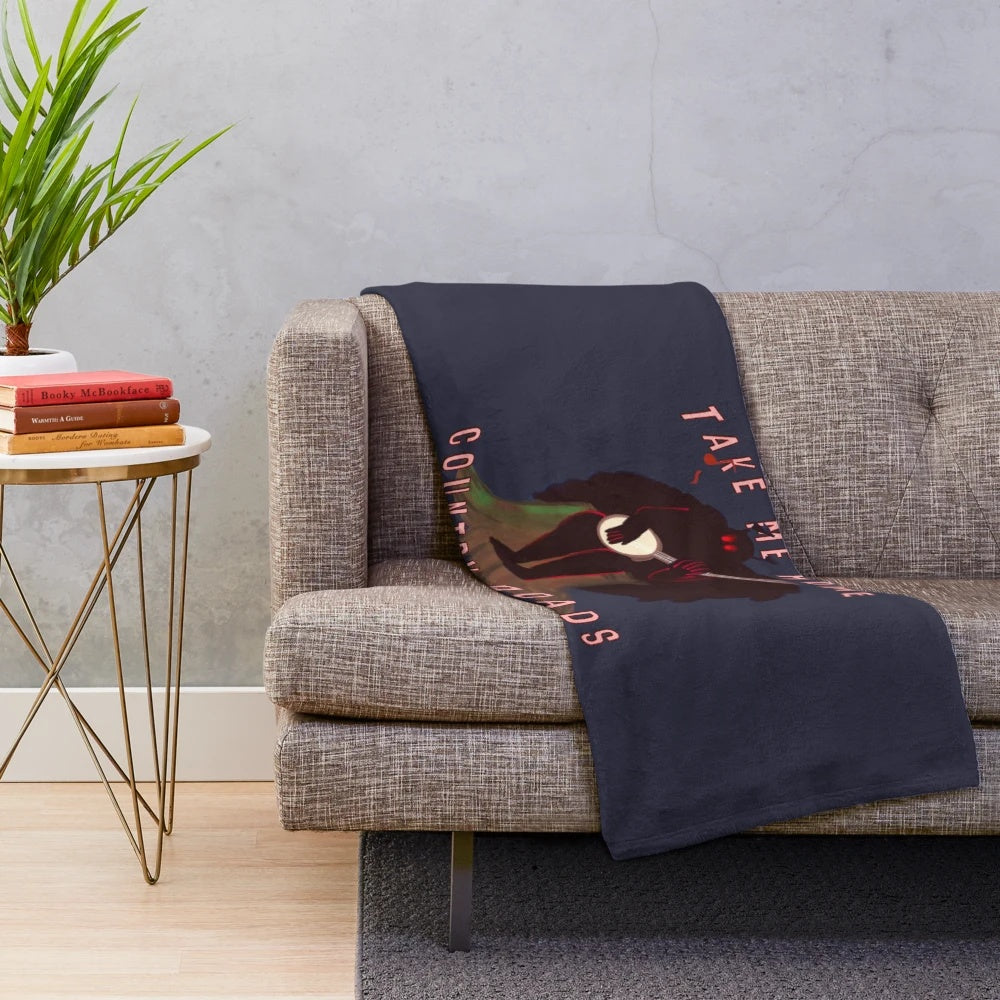 Mothman plush blanket with a banjo, featuring the iconic West Virginia cryptid