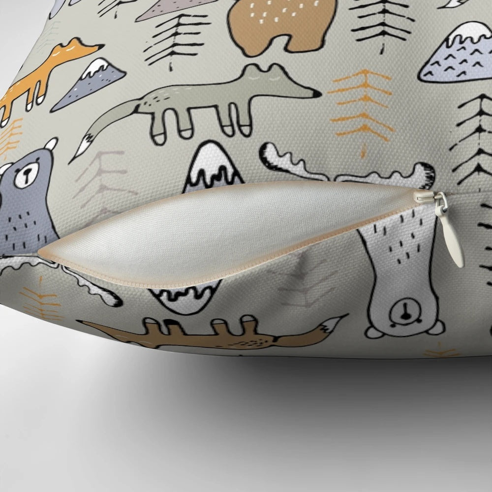 Colorful mountain scene with cute forest animals like bears, moose, and foxes on a plush pillow