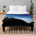 Mountain biking plush blanket with blue sky silhouette