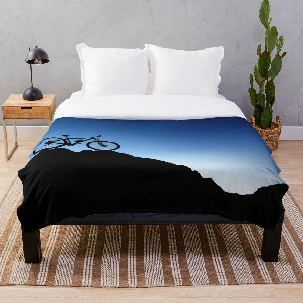 Mountain biking plush blanket with blue sky silhouette