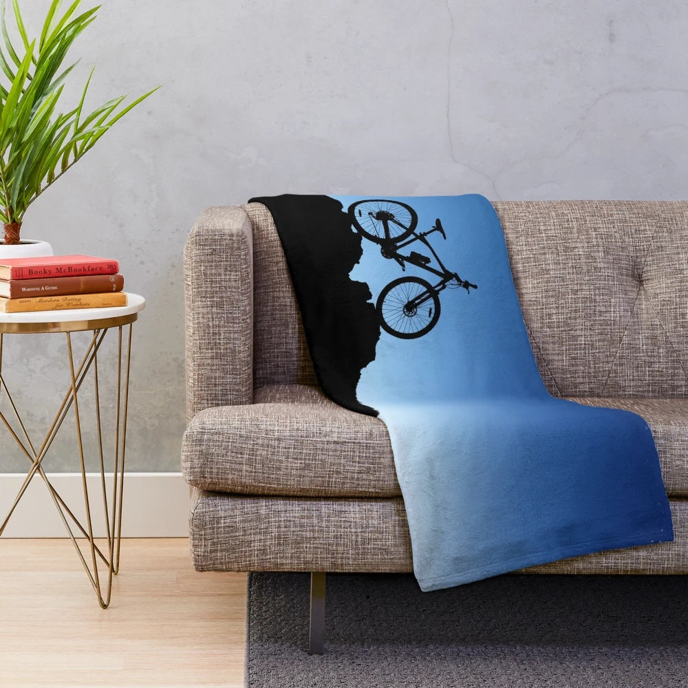 Mountain biking plush blanket with blue sky silhouette