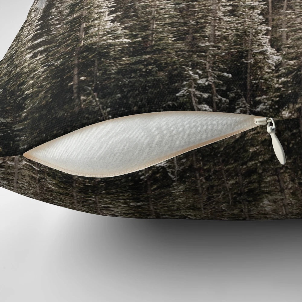 Soft and plush mountain forest pillow with snow-capped trees, fog, and a golden hour glow