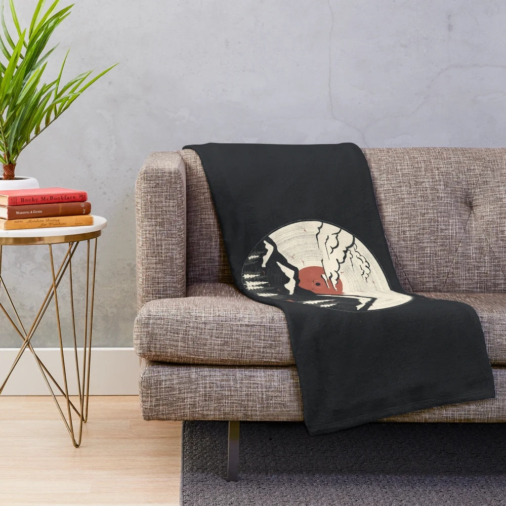 Plush blanket featuring mountain, wildlife, and nature-inspired design