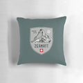 Decorative throw pillow featuring an emblem design inspired by the scenic Swiss Alps mountains