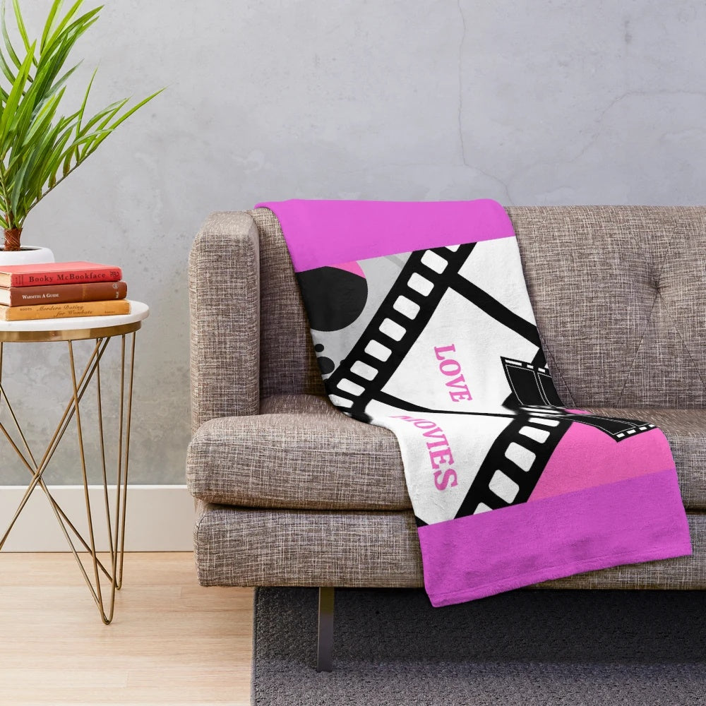 Cozy plush blanket for movie lovers featuring a "I LOVE MOVIES" design
