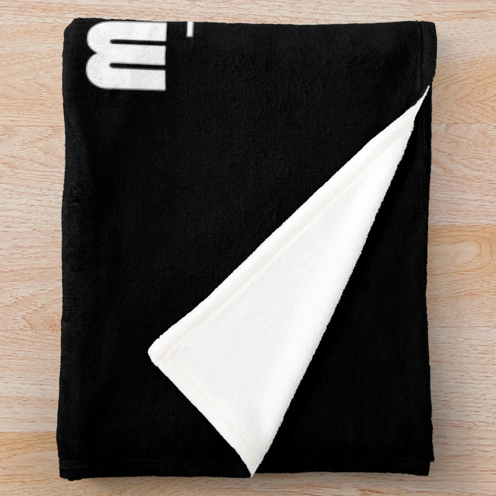 Plush blanket with a cinematic logo design, perfect for movie enthusiasts