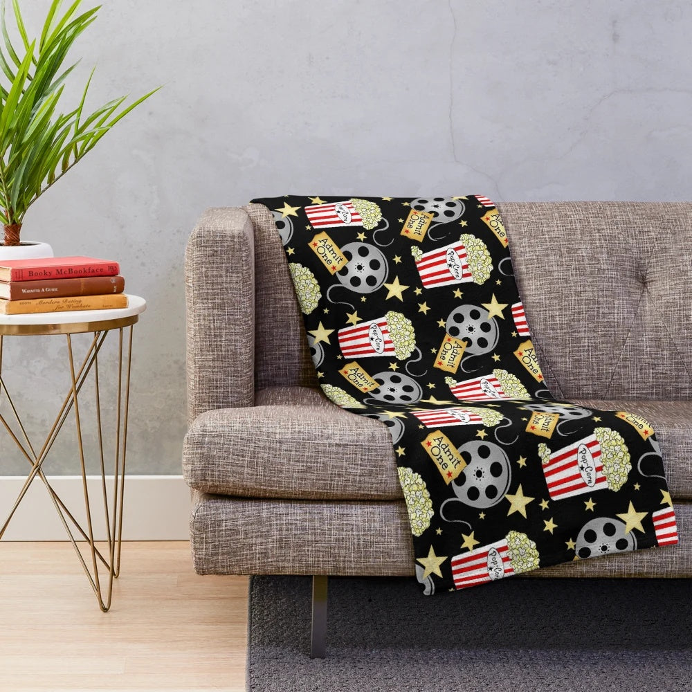 Plush blanket with popcorn design, perfect for movie nights