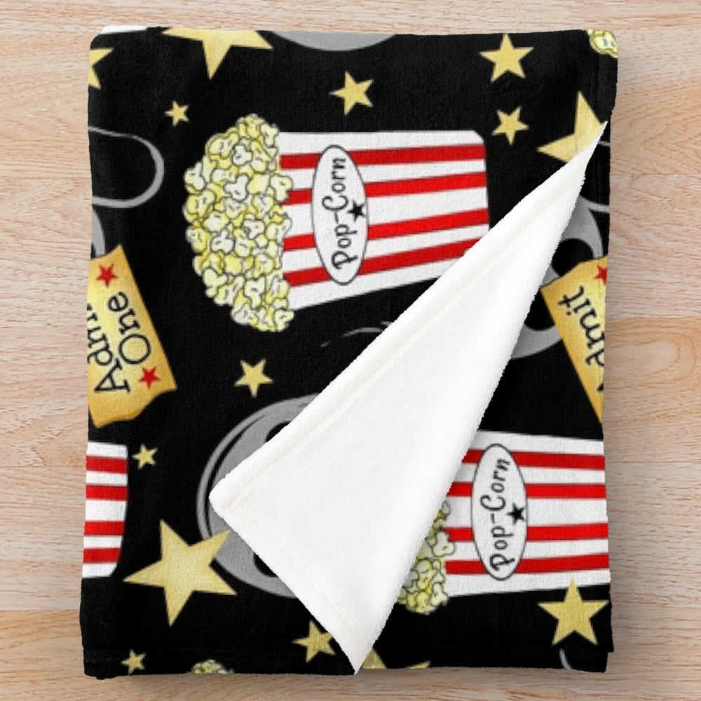 Plush blanket with popcorn design, perfect for movie nights