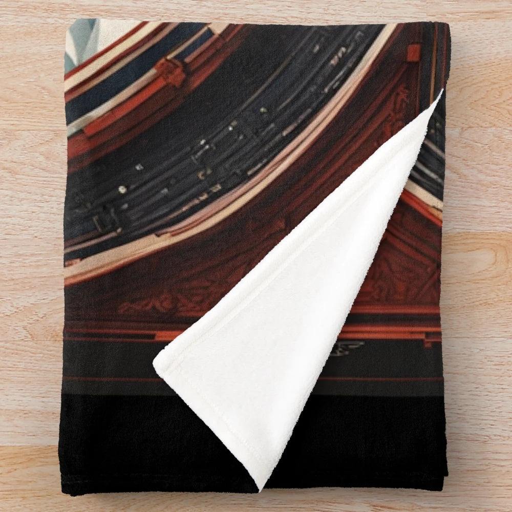 A plush movie-themed blanket with a classic film design