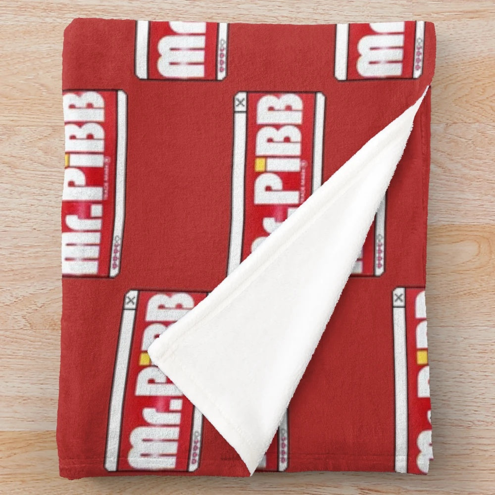 Mr. Pibb-themed plush blanket for cozy comfort