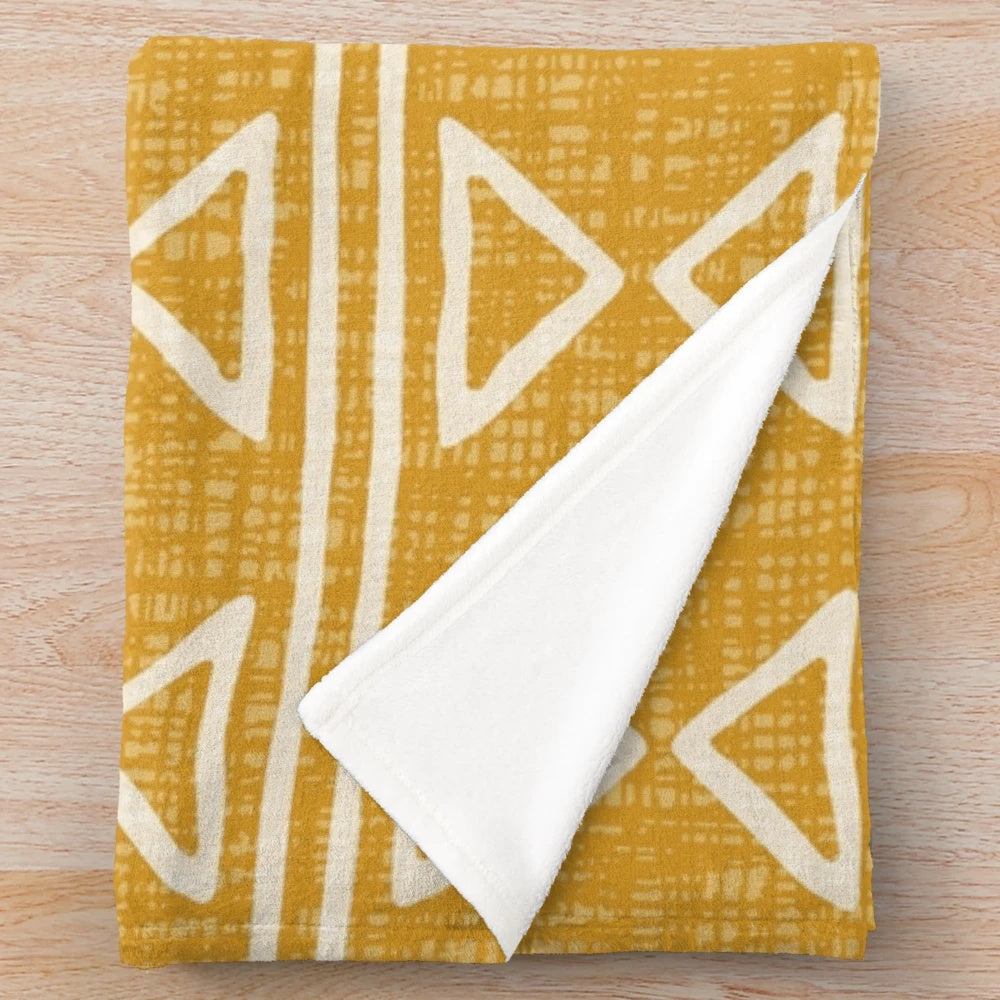 Mud cloth patterned plush blanket in earthy tones