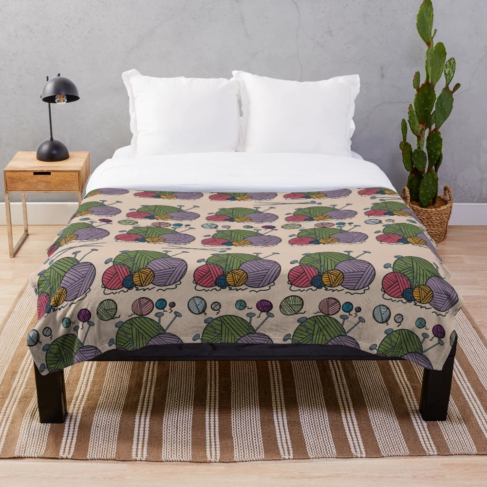 Multi-colored knitted plush blanket