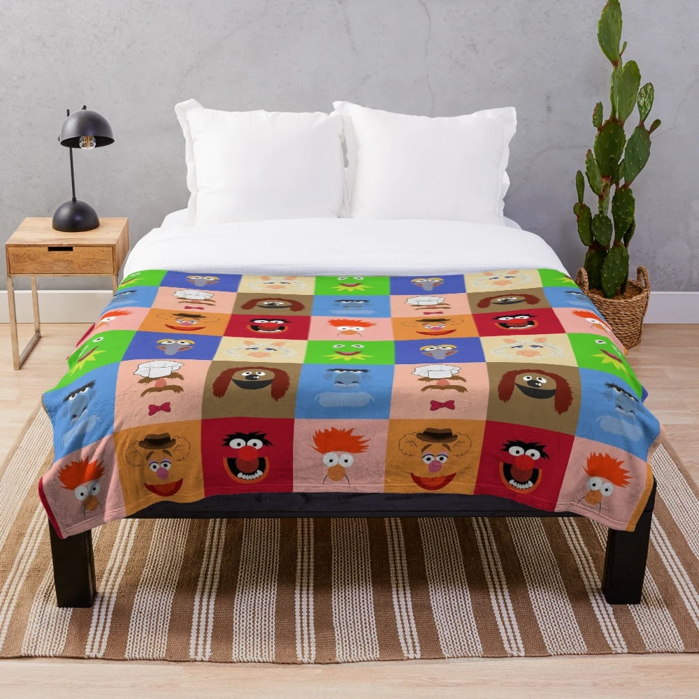 Muppets-themed plush blanket featuring characters like Kermit, Miss Piggy, and Fozzie Bear