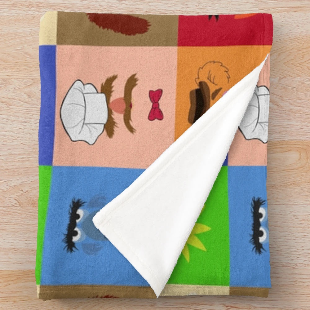 Muppets-themed plush blanket featuring characters like Kermit, Miss Piggy, and Fozzie Bear